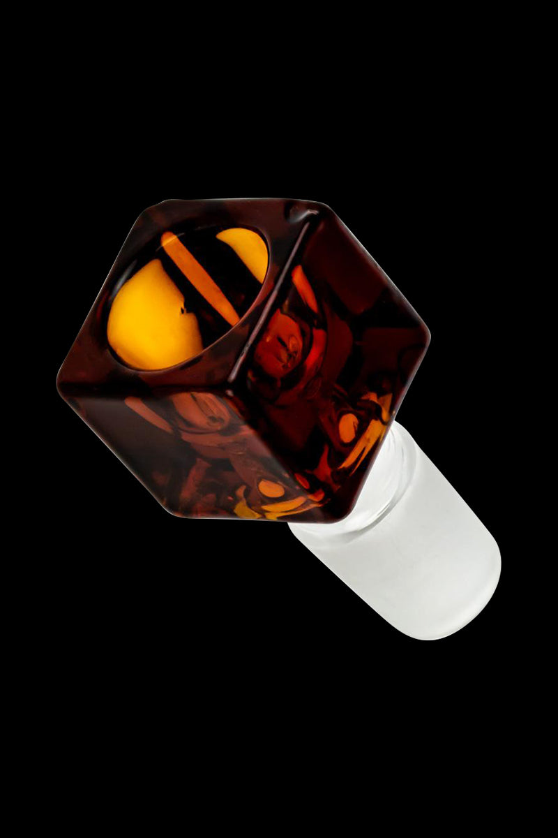 Angled close-up of a translucent amber Square Glass Bowl showing glossy facets and a white frosted stem against black background