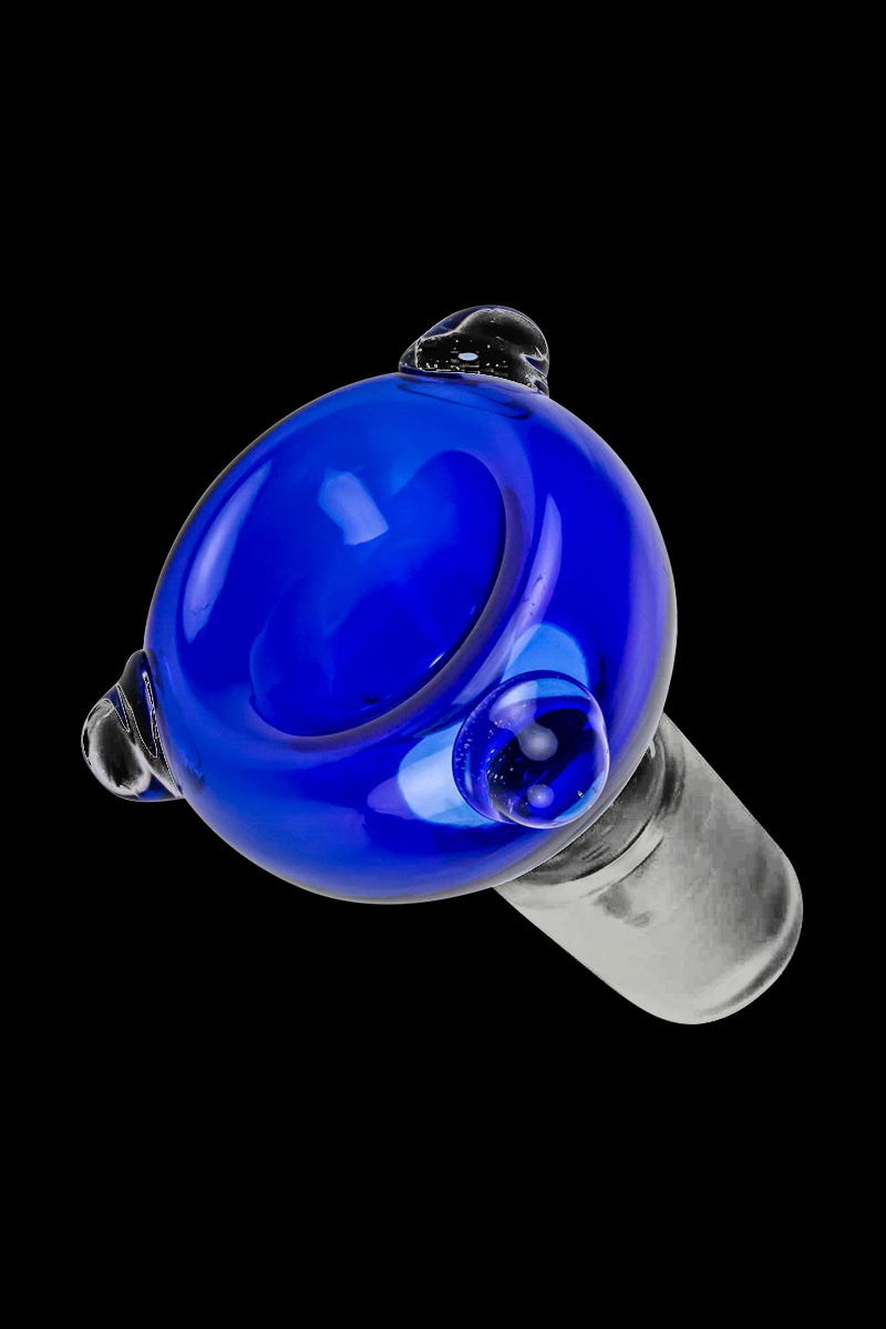 A close-up, angled view showcases the Cobalt Blue Glass Bowl with Glass Marbles, featuring a smooth, rounded blue glass design.
