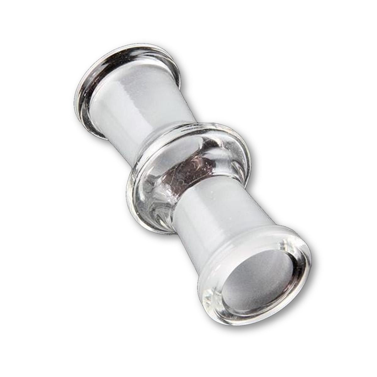 Angled close-up of a clear Sleek And Simple Female To Female Adapter showing both glazed ends and the short cylindrical glass body against a white background