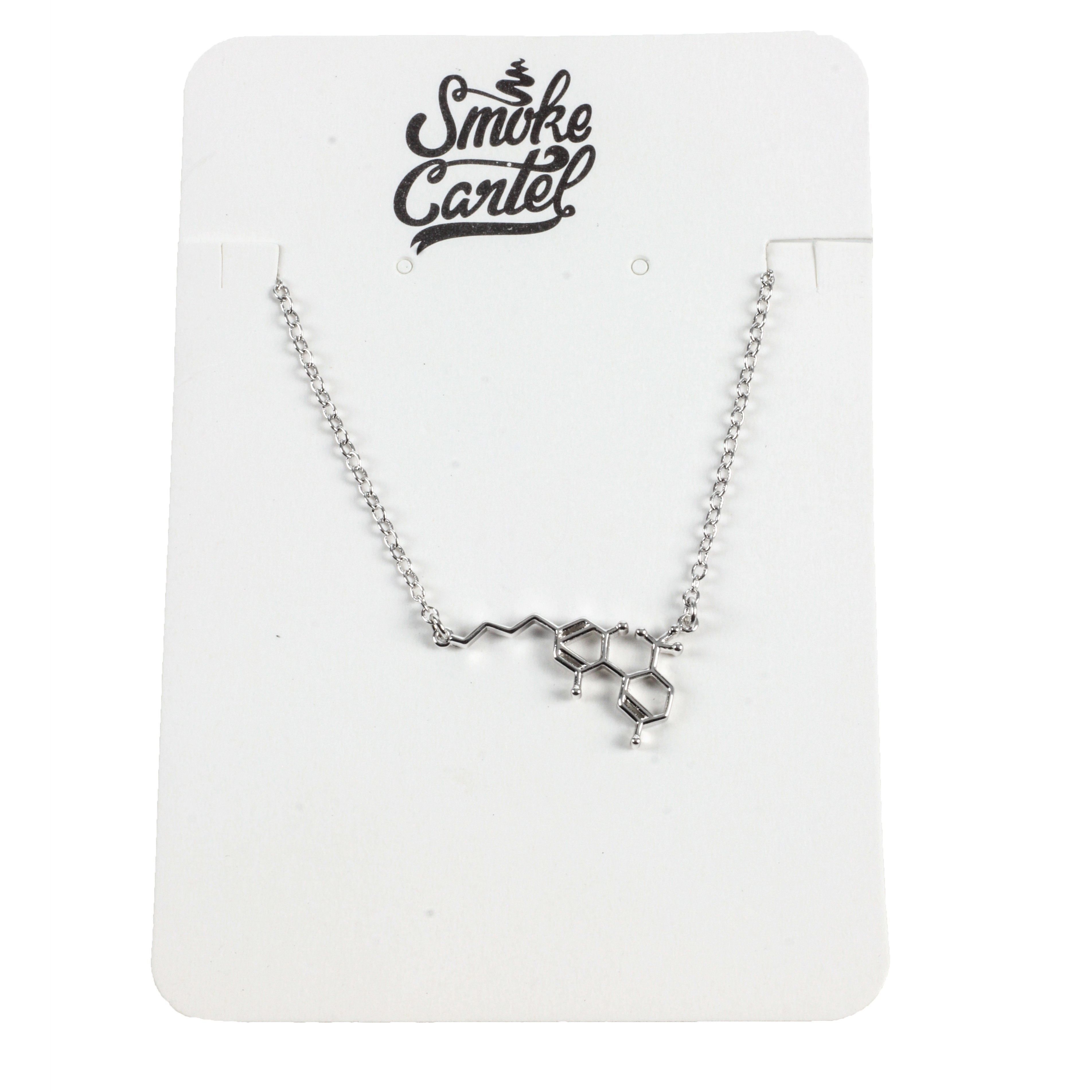 A close-up shot of the silver Smoke Cartel THC Molecule Bracelet lying flat against a plain white backdrop.