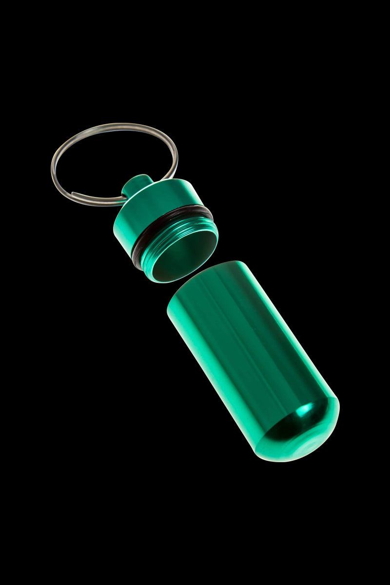 A sleek, angled view of the Discrete Key Chain Stash Jar, appearing as a metallic container with a screw-on lid and attached key chain.
