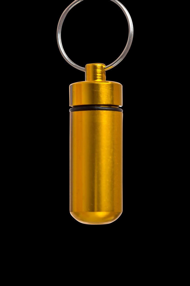 Front view of the Discrete Key Chain Stash Jar, a metallic cylinder with a key chain loop, isolated on a white background.