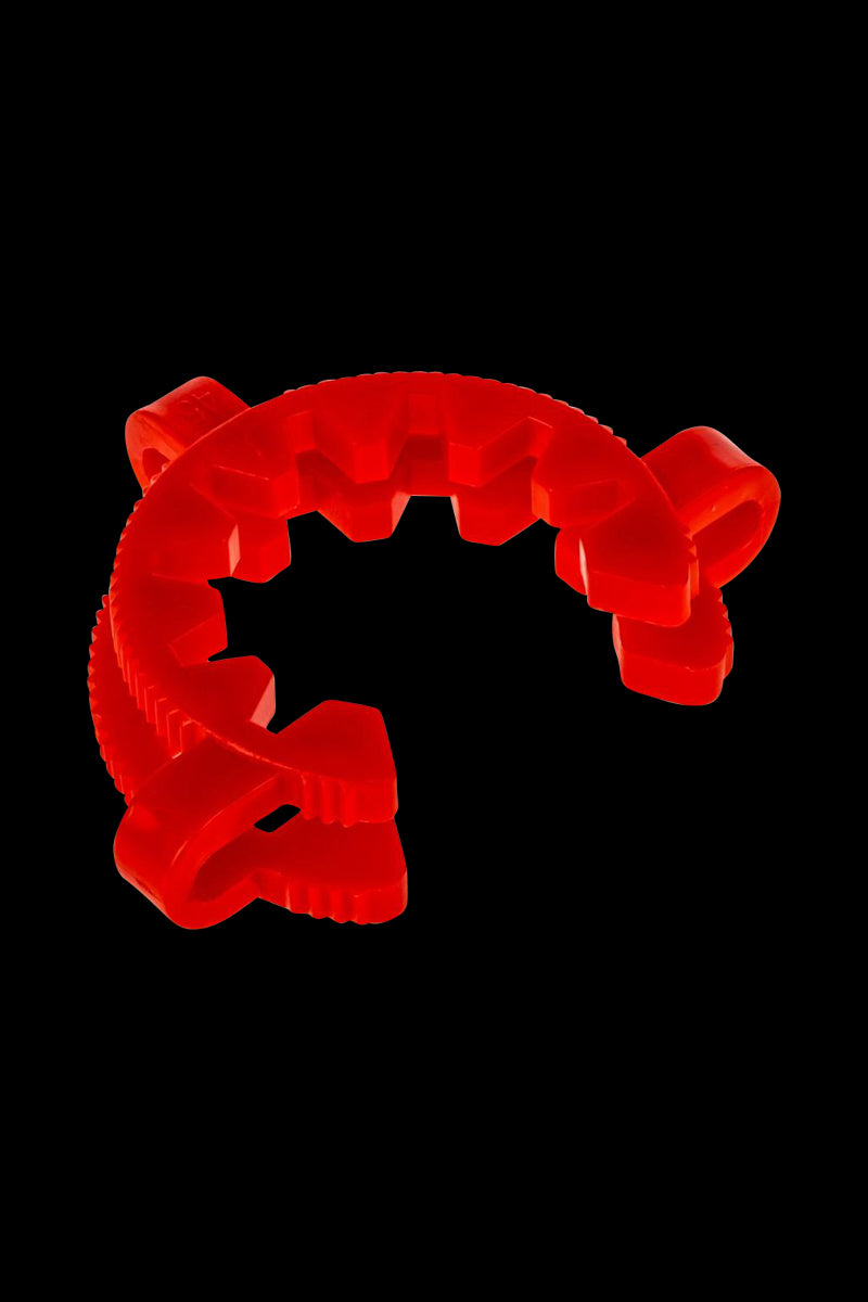 A close-up shot of the Acrylic Keck Clip - 50mm, showcasing its transparent design against a plain black background.