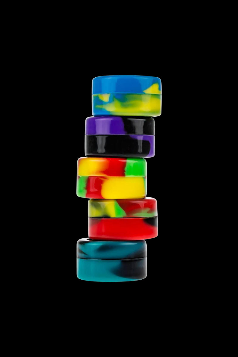 Front view of the Silicone Non-Stick Stash Container, stacked with several colorful, circular containers on a dark background.