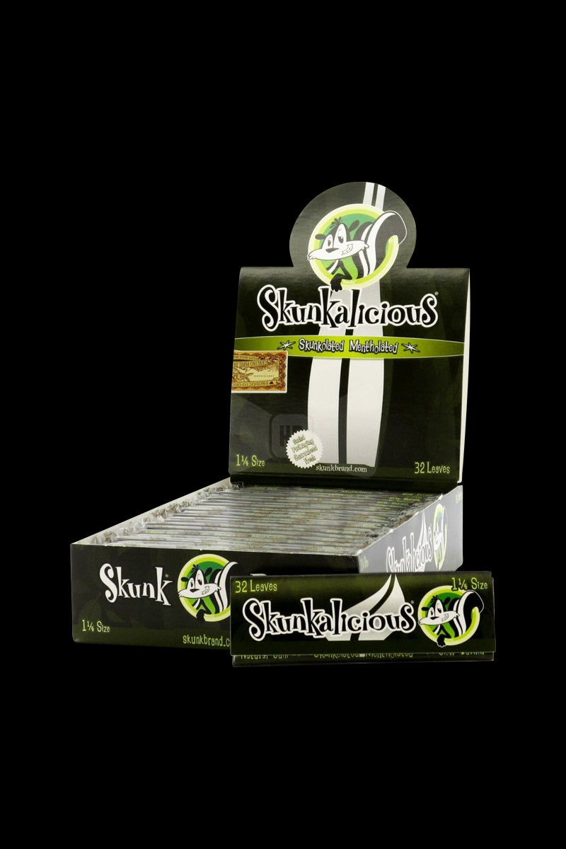Front three-quarter view of a display box of Skunk 1 1/4 Mentholicious Rolling Papers showing stacked single packs and logo.