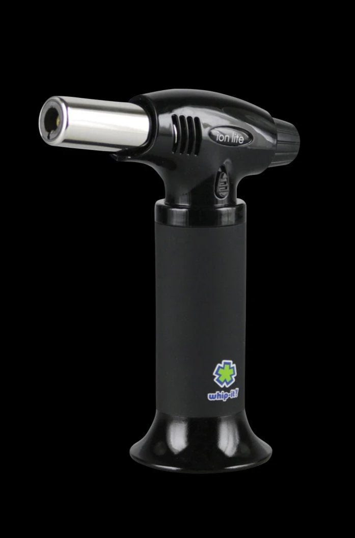 A close-up, angled view of the whip-it! Ion Lite Torch Lighter with a black body and silver burner tip.