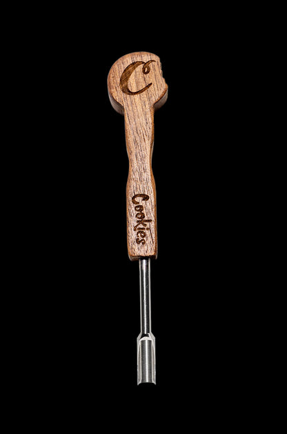 Wooden cannabis dab tool with metal tip and “Cookies” branding on a black background.