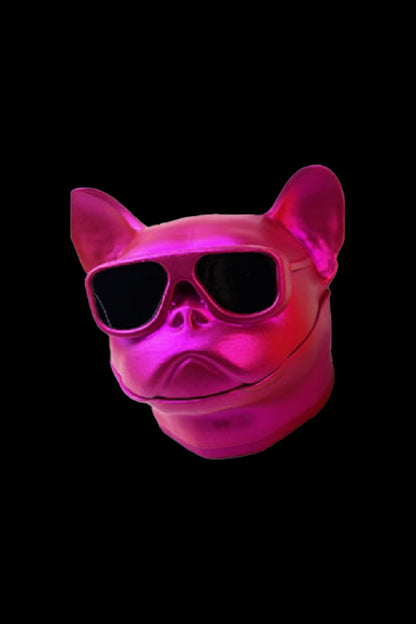 Neon pink French bulldog sculpture wearing sunglasses, likely promoting cannabis accessories.