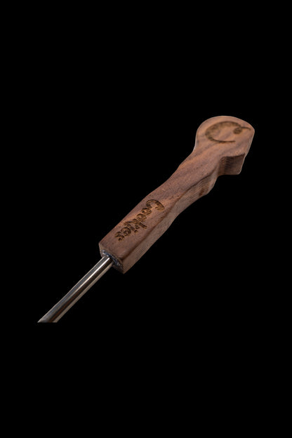Wooden cannabis dab tool with a stainless steel tip.