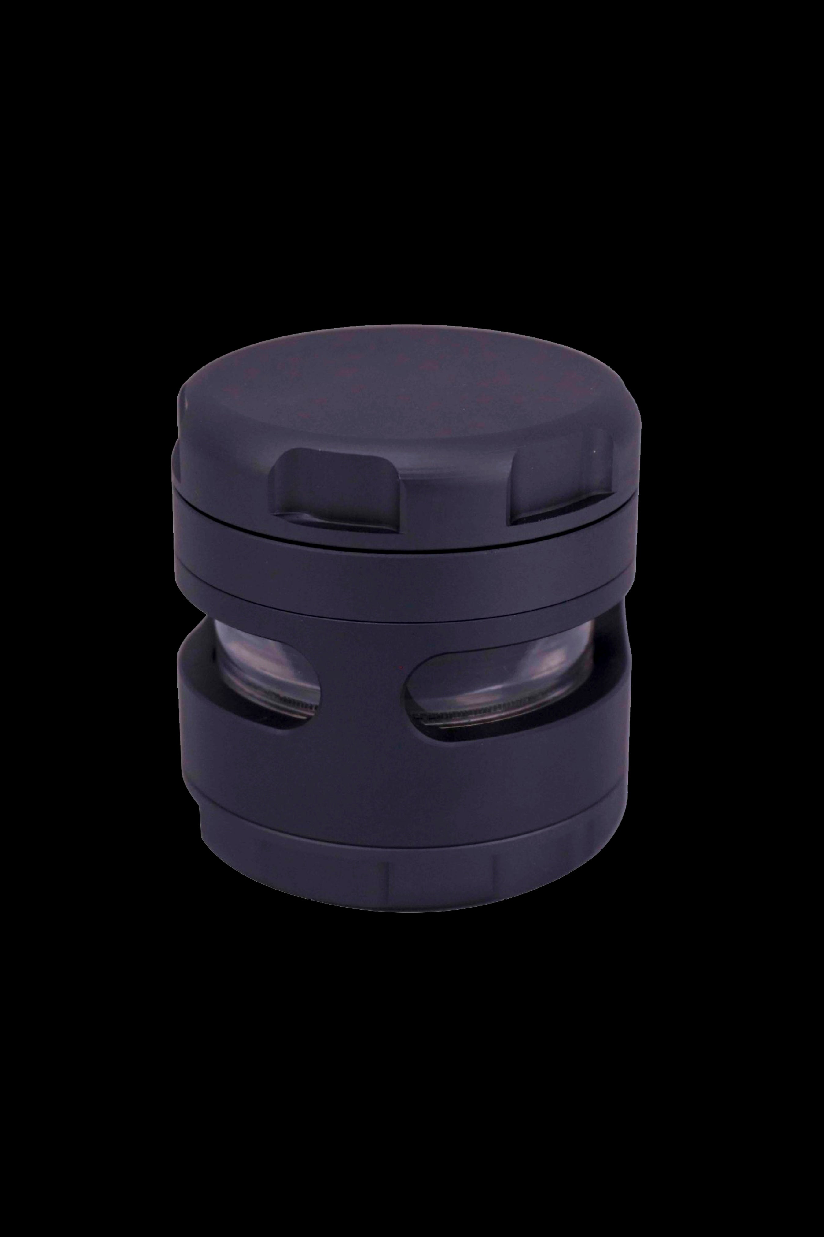 Dark purple cannabis grinder with visible grinding teeth and chambers.