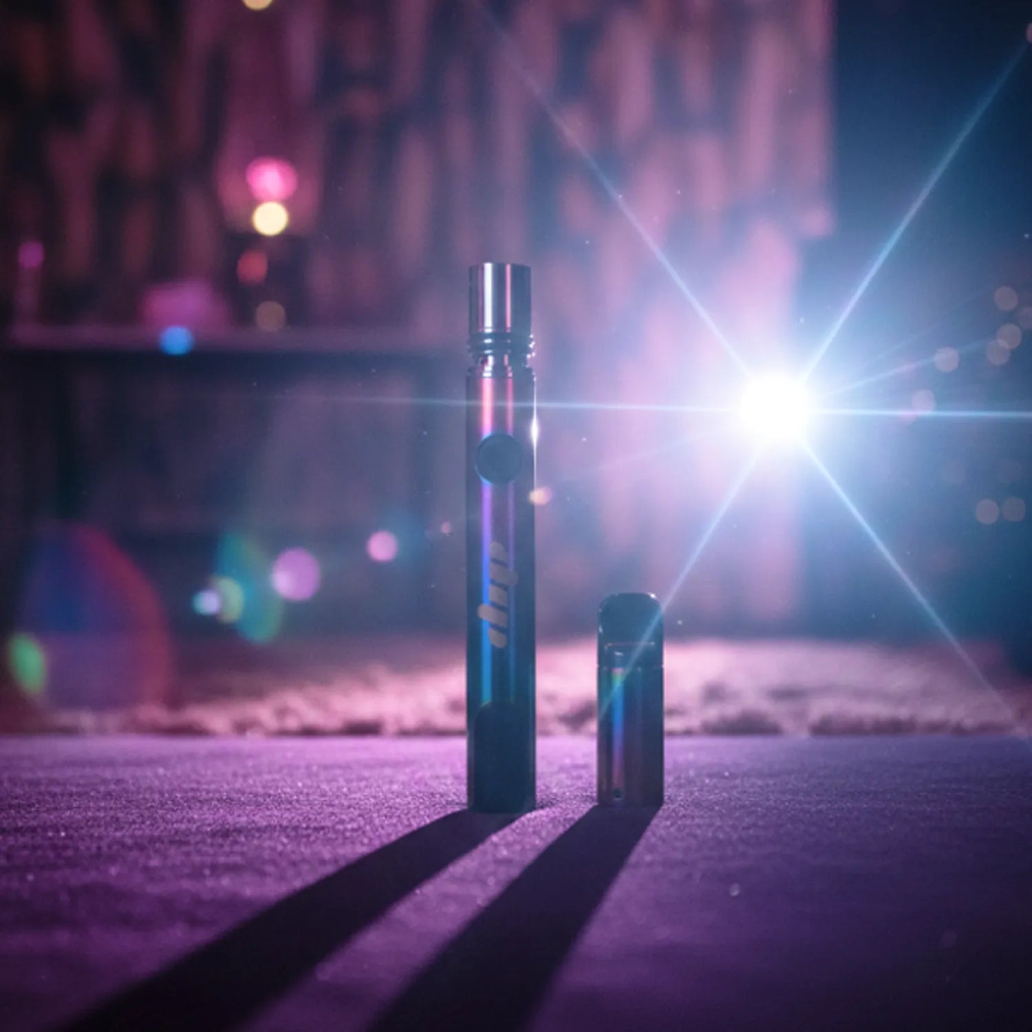 Centered front view of the Dip Devices Lunar Upgraded pen and cap standing on a purple surface with a bright starburst light and soft bokeh background.