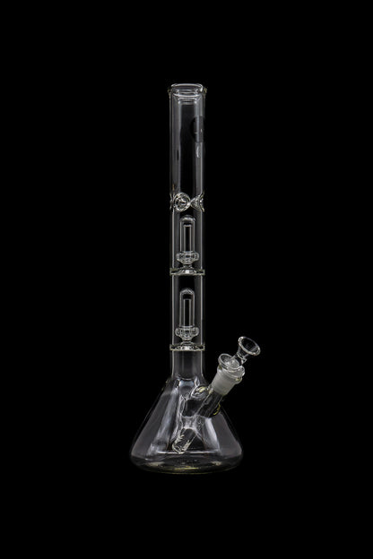 Clear glass bong with multiple perc filtration chambers, isolated on a black background.