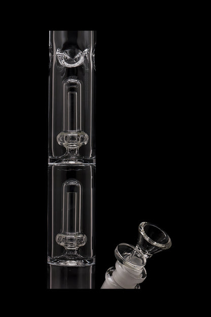 Clear glass bubbler with a separate glass bowl piece, isolated on a black background.
