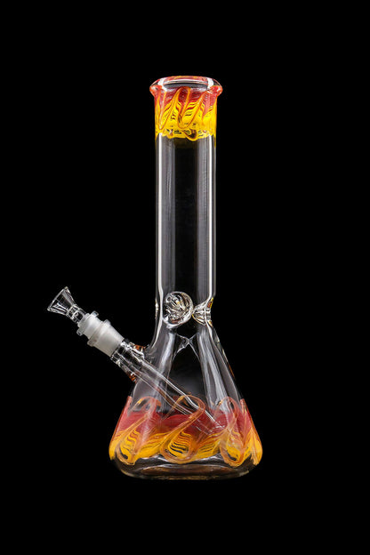Glass water pipe with orange and yellow swirls, isolated on black.