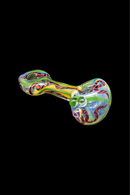 Colorful glass smoking pipe isolated on a black background.