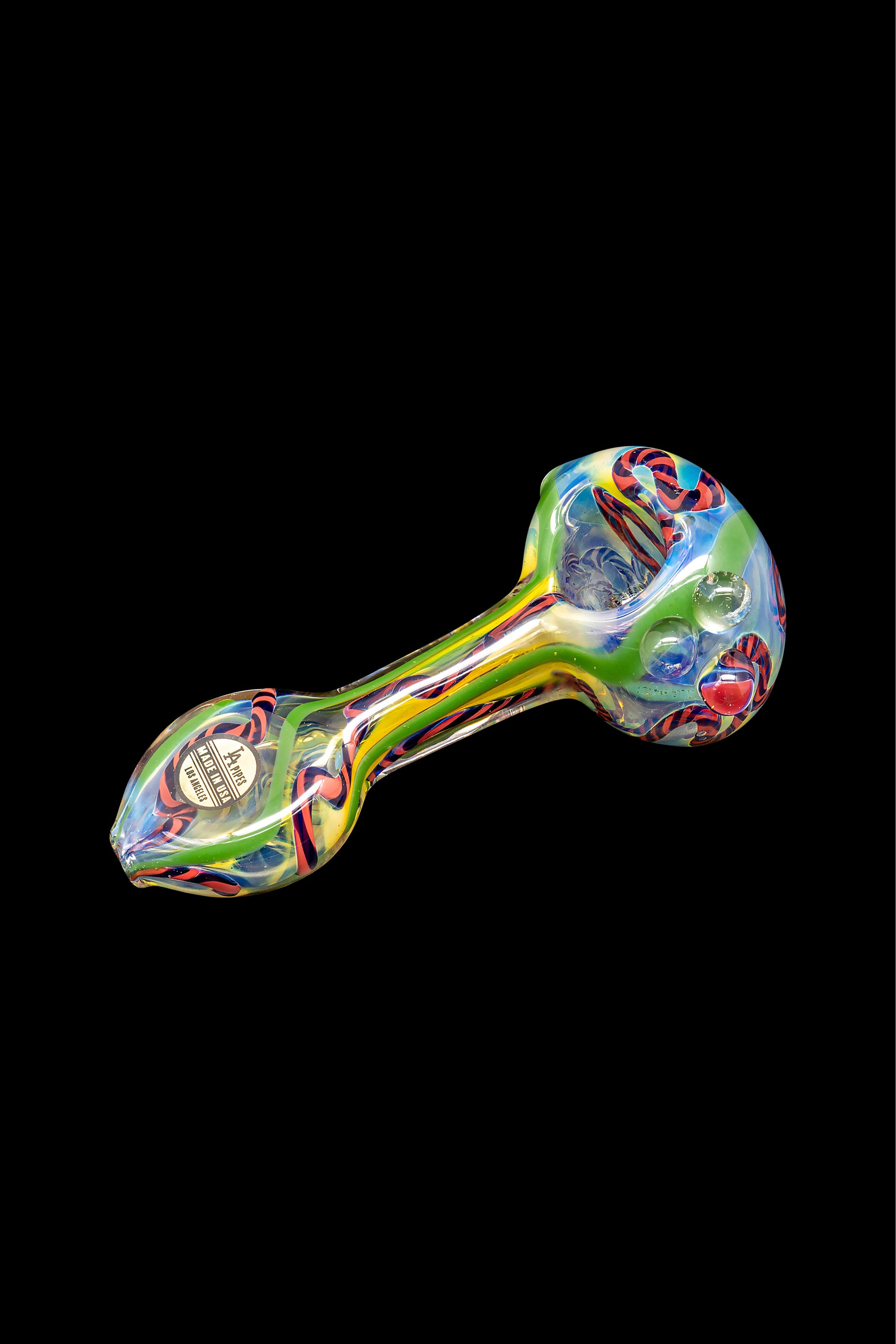 Colorful glass smoking pipe on a black background.