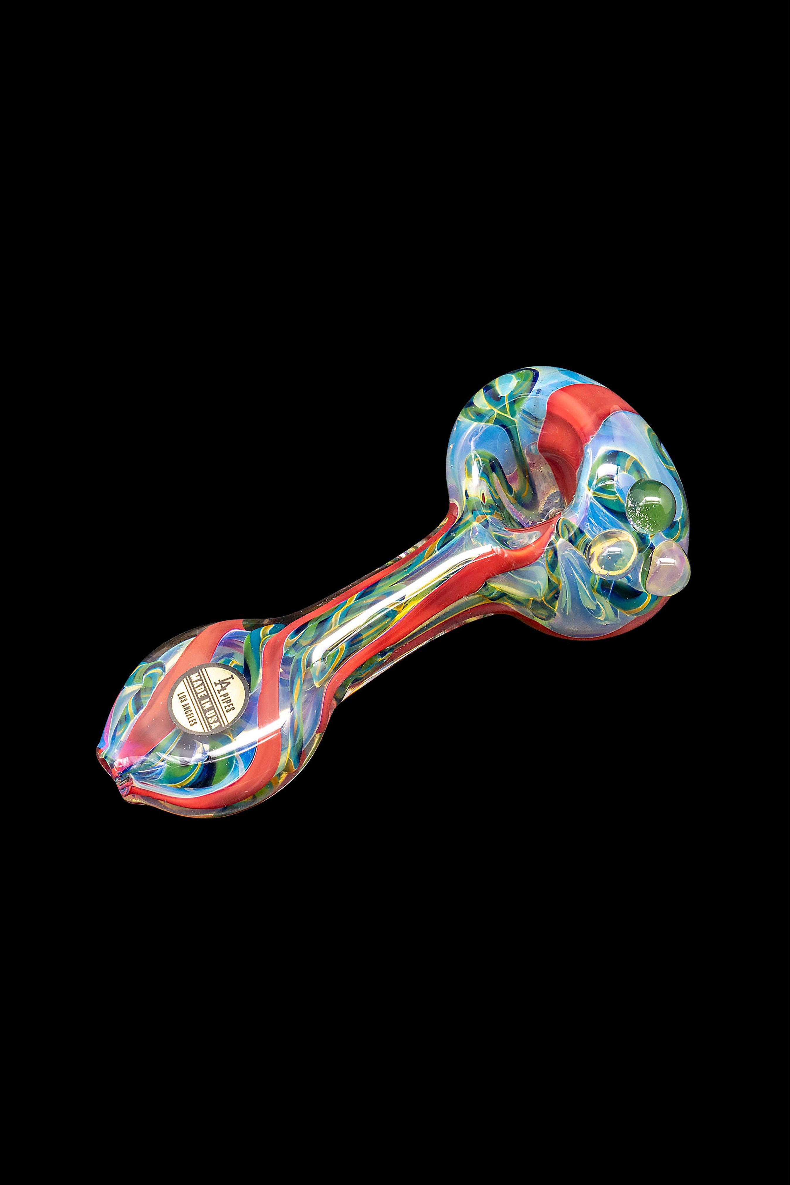 Colorful glass pipe with green accents, isolated on a black background.