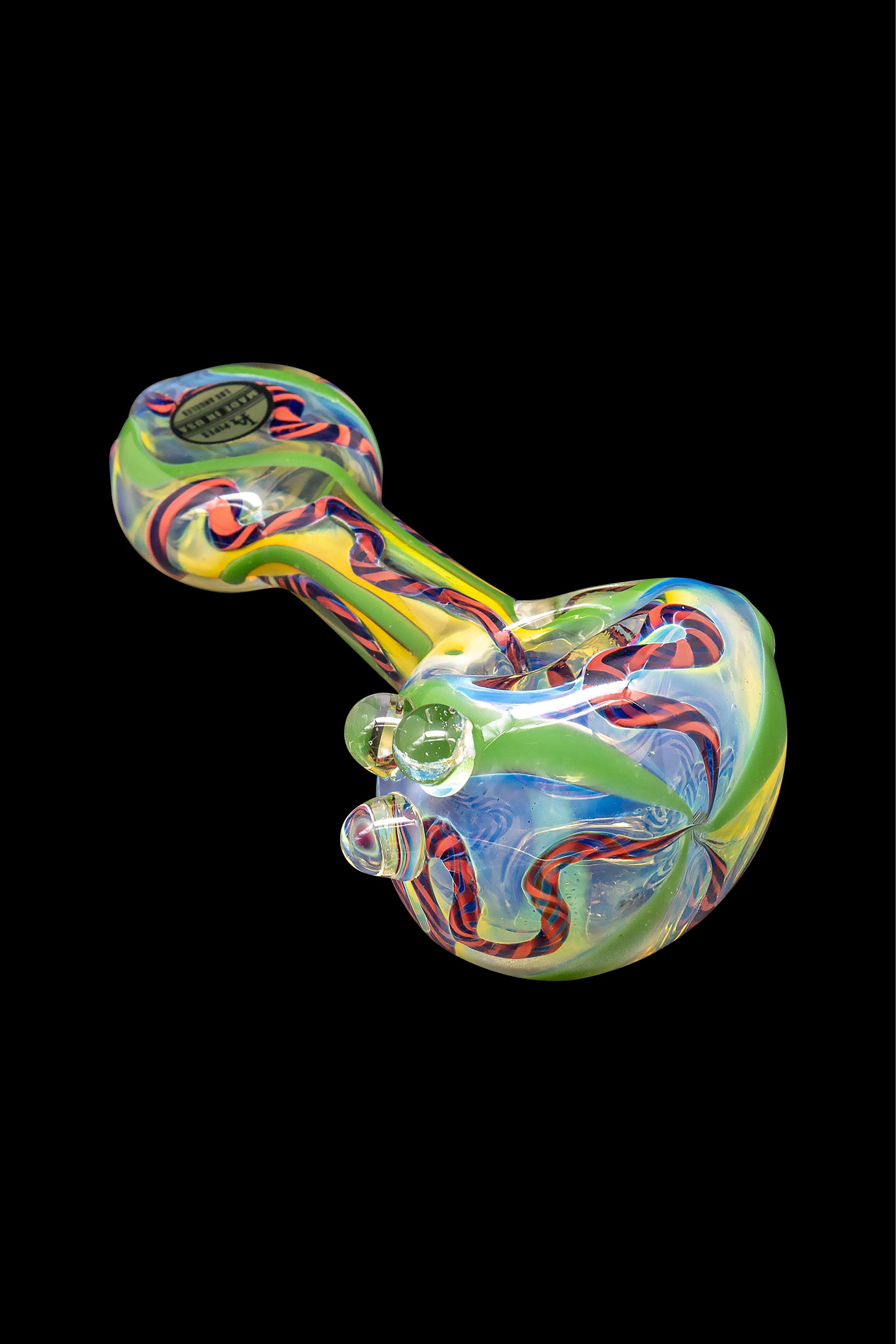 Colorful glass pipe against a black background.