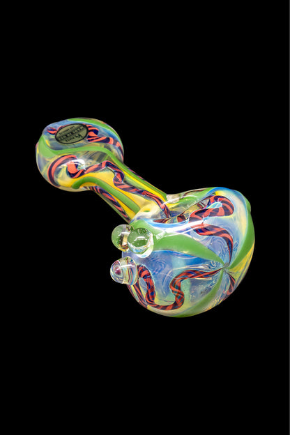 Colorful glass pipe against a black background.