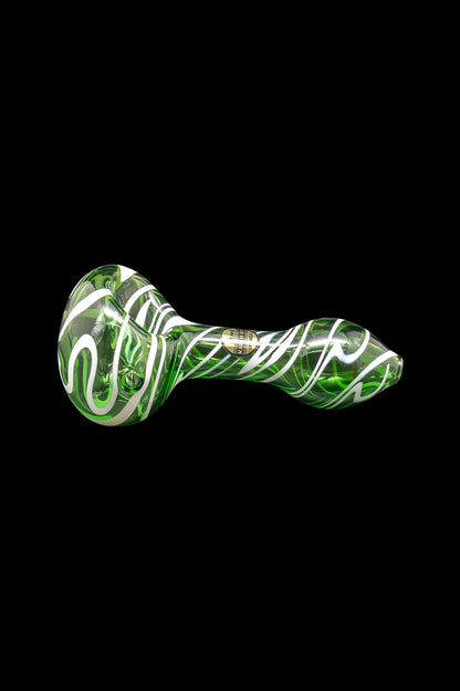 Green and white swirled glass smoking pipe on a black background.