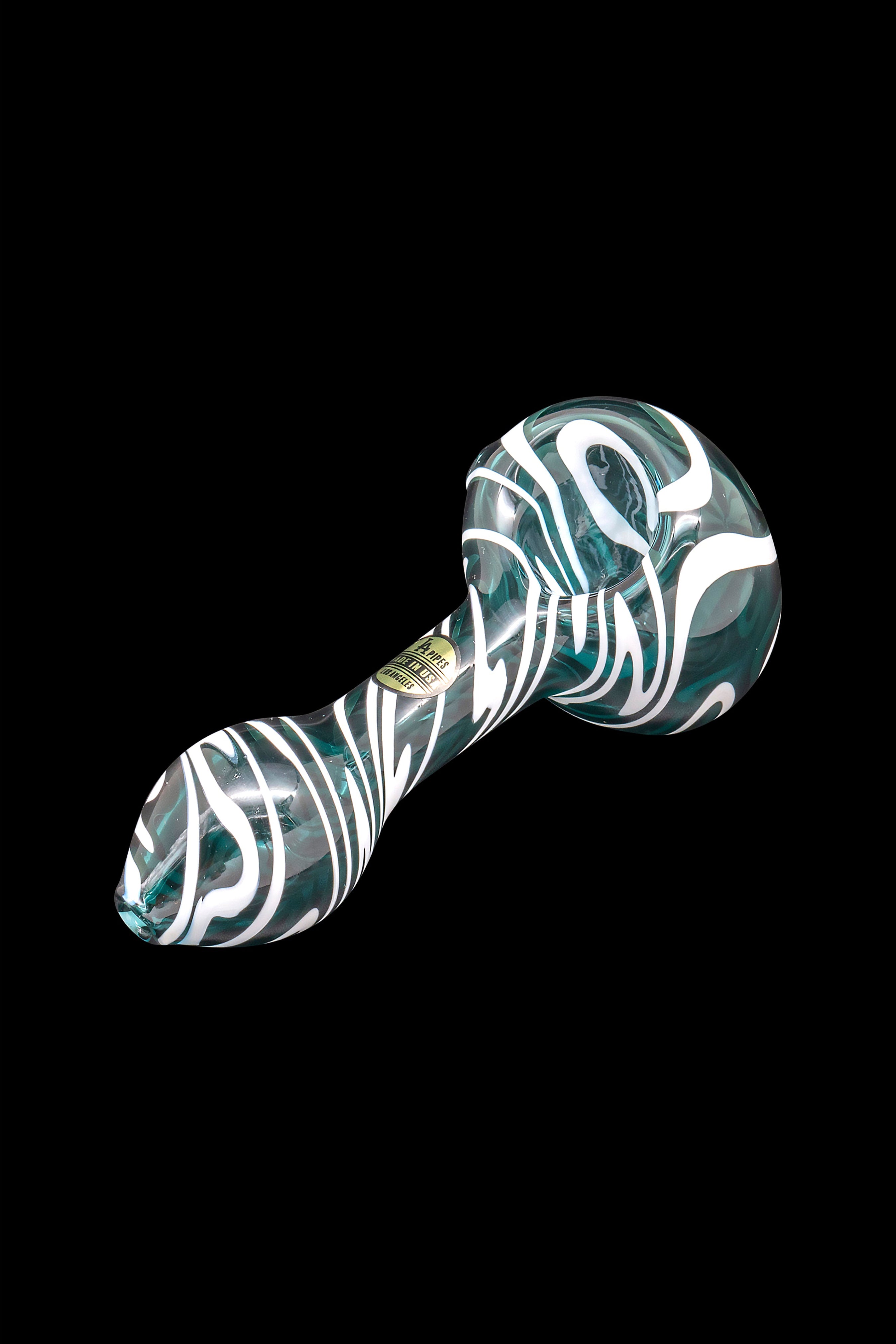 Green and white swirled glass smoking pipe on a black background.