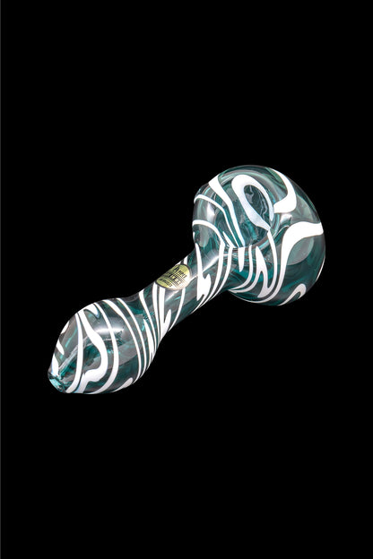 Green and white swirled glass smoking pipe on a black background.