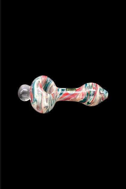 Colorful glass pipe against a black background.