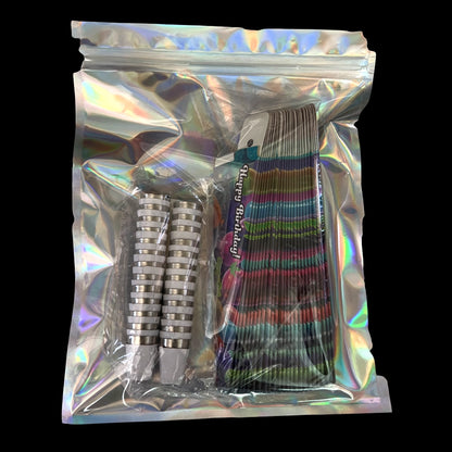 Top-down view of a holographic zip bag showing the Dispoze-a-Bowl® "HAPPY BIRTHDAY" Party Favors 25-Pack with stacked colorful forks.