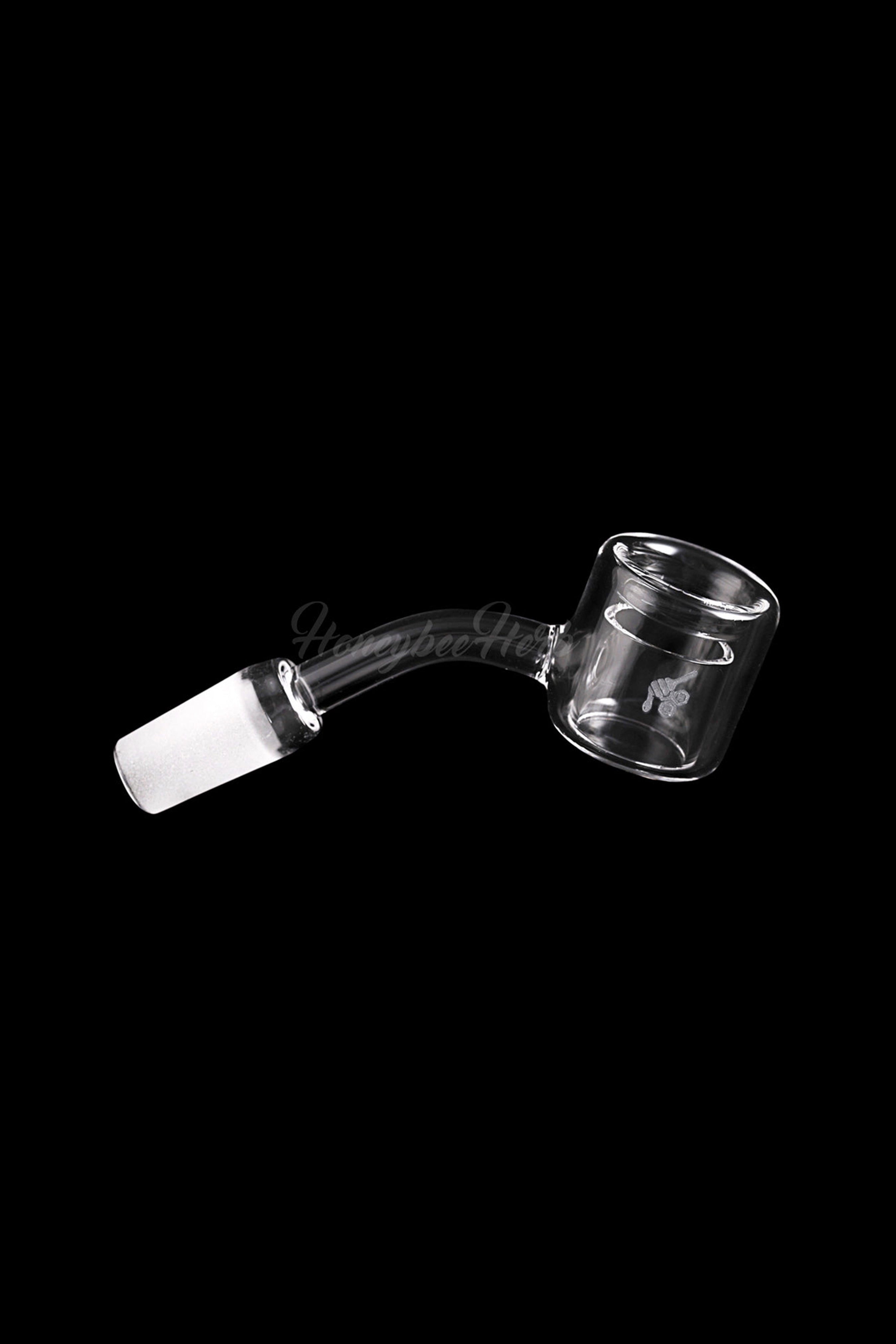 Clear glass cannabis oil rig banger with a frosted joint.