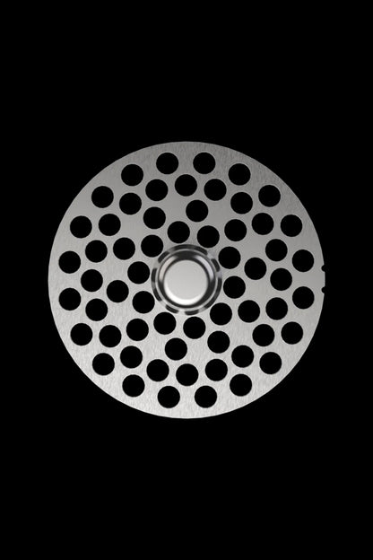 Metal grinder plate with numerous circular holes, isolated on black.