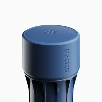 Close-up angled view of the blue STAZE PRESERVE showing the textured top with vent slots and the embossed side logo.