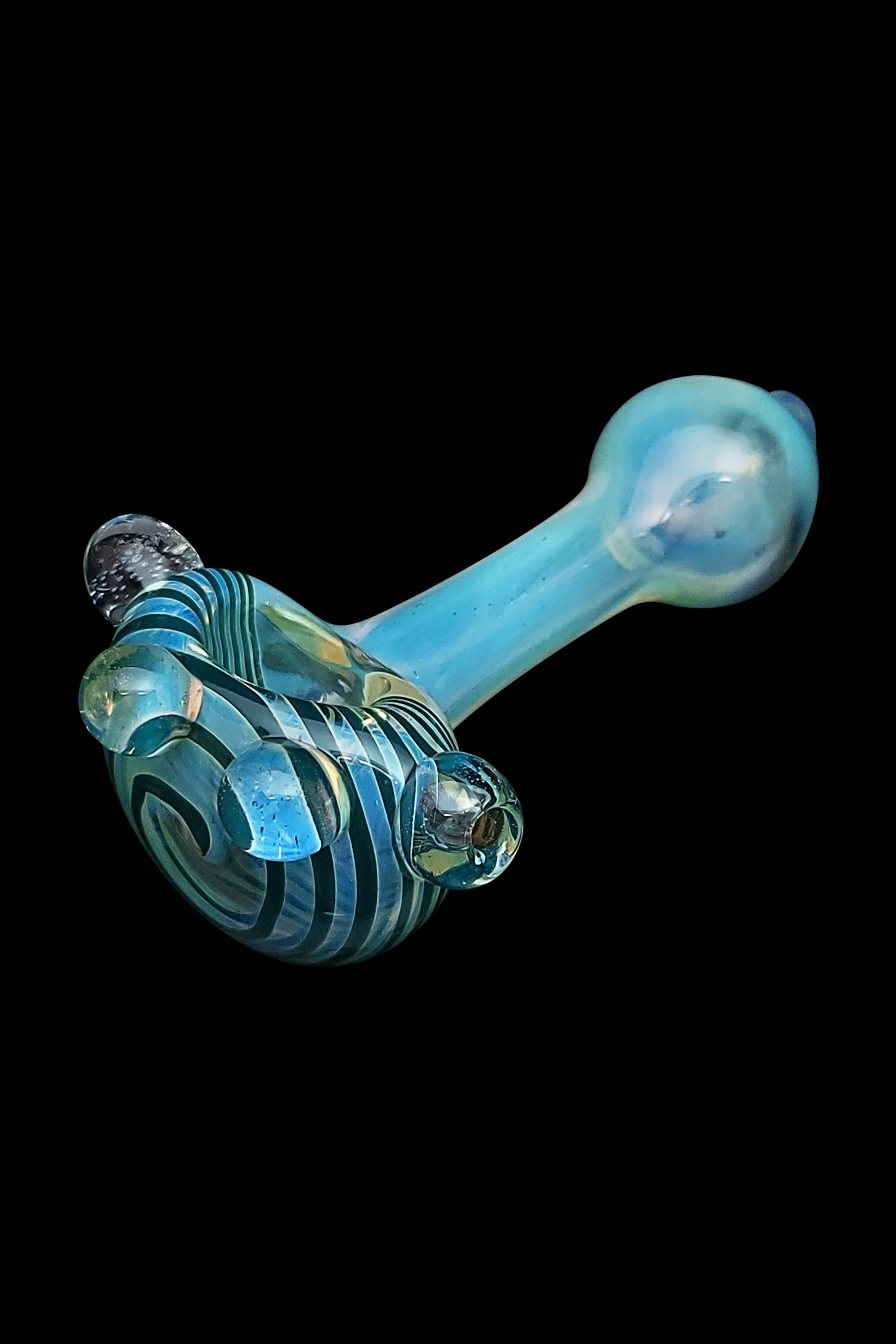 Hand-blown glass pipe with swirling blue and teal patterns against a black background.