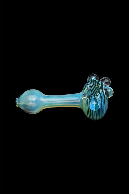 Hand-blown glass pipe with teal and blue swirls.
