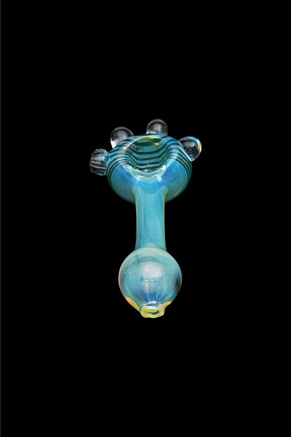 Blue glass pipe isolated on a black background.