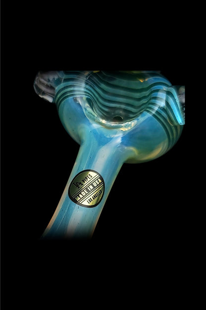Blue glass cannabis pipe with "Made in USA Los Angeles" label against a black background.