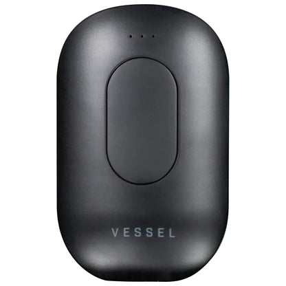 Close-up top-down view of the matte black Freeze Pipe Vape Pen showing its rounded rectangular body, three tiny LED holes, and faint "VESSEL" logo.