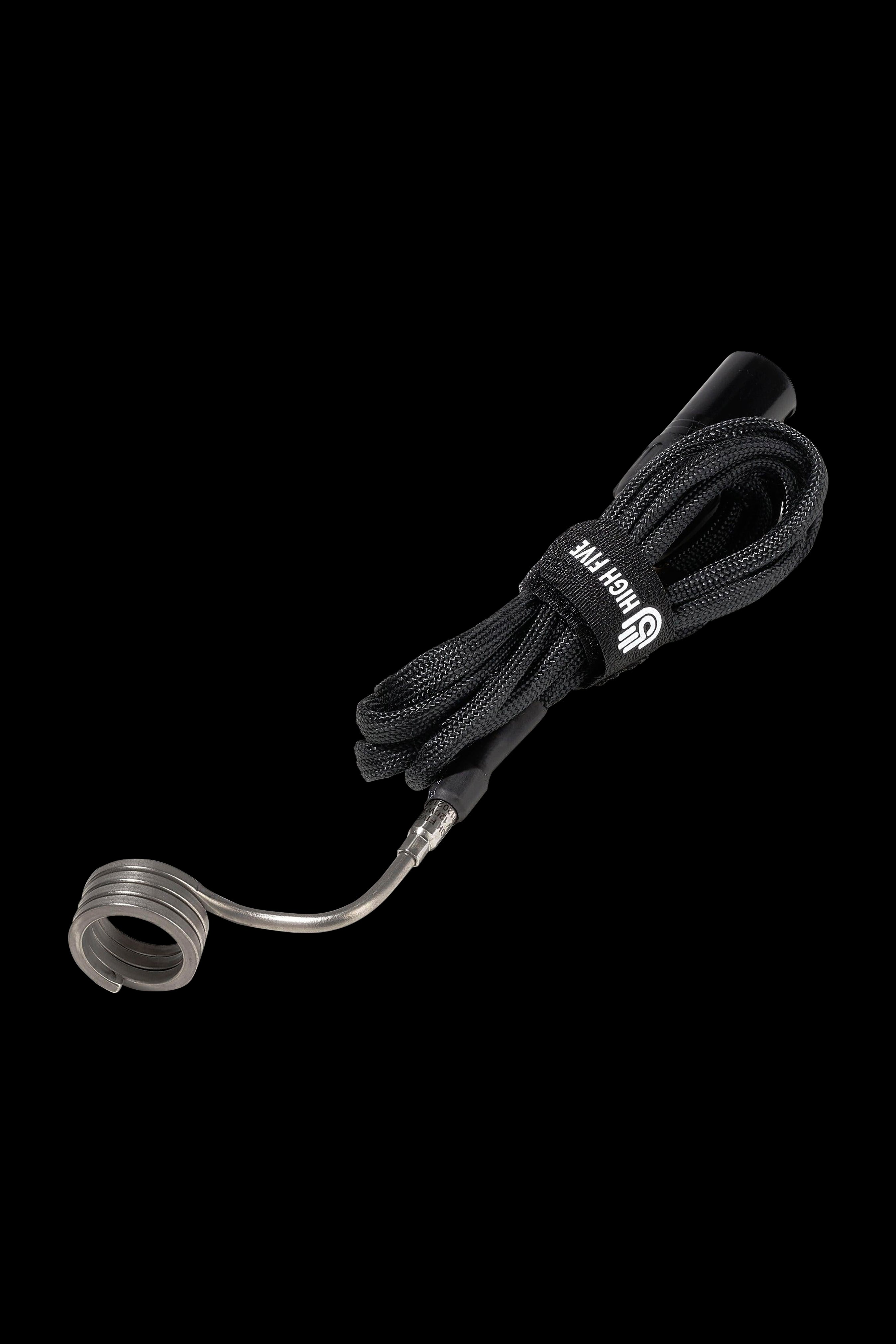 Coiled quartz dab rig nail with a braided black silicone sleeve and mouthpiece, isolated on a black background.