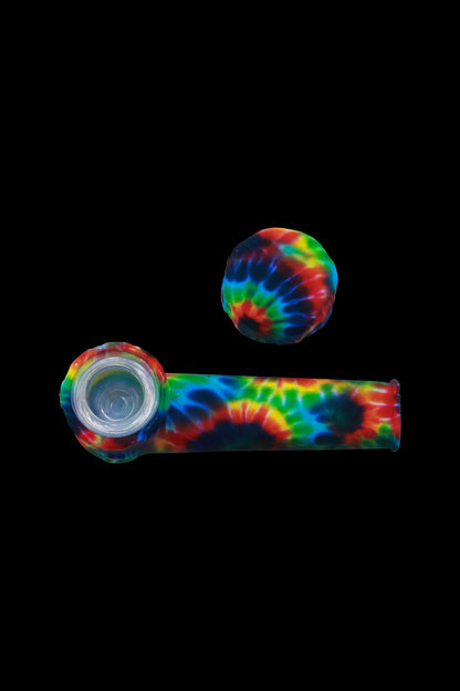 Colorful silicone pipe and cap set against a black background.