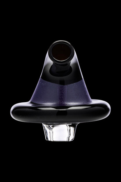 Purple and black glass dab cap for concentrating cannabis.