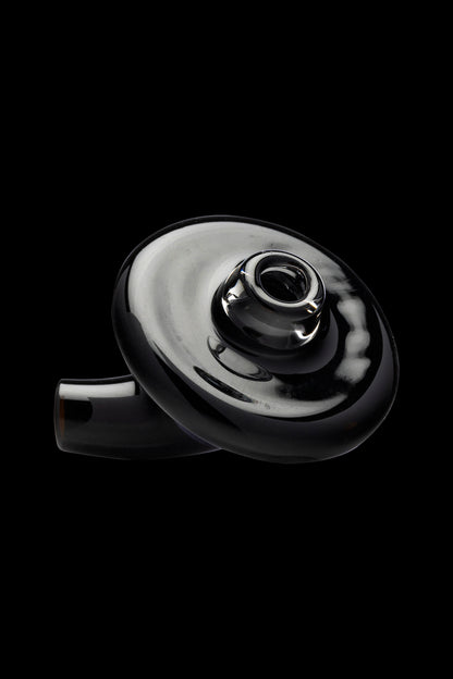 Black glass cannabis bubbler against a dark background.