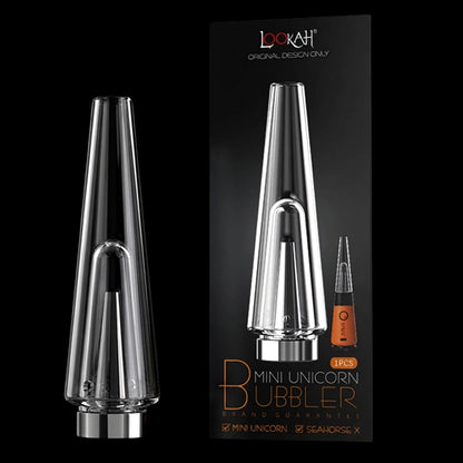 Close-up front view of the clear glass Lookah Mini Unicorn Bubbler against a black backdrop with its packaging shown to the right.