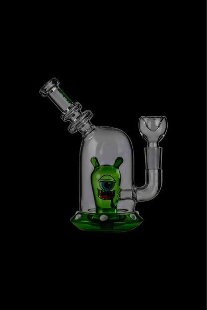 Green glass cannabis water pipe (rig) with a cartoon monster design.