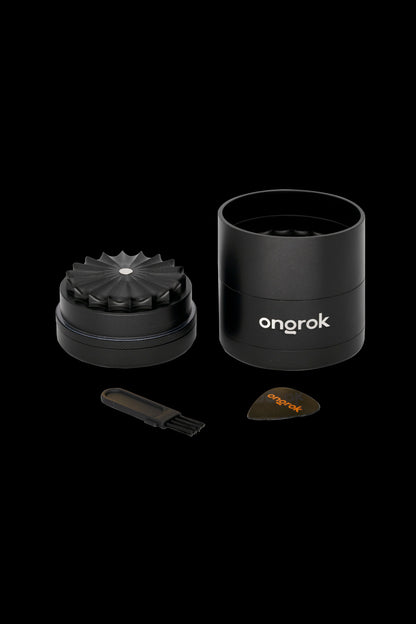 Black Onrok grinder with components displayed on a dark background.