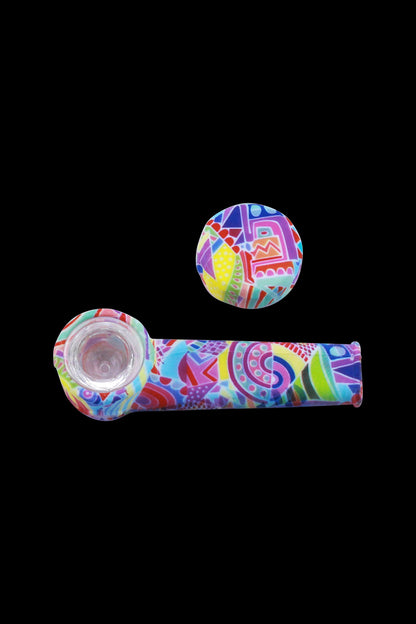Colorful glass pipe and mouthpiece set against a black background.