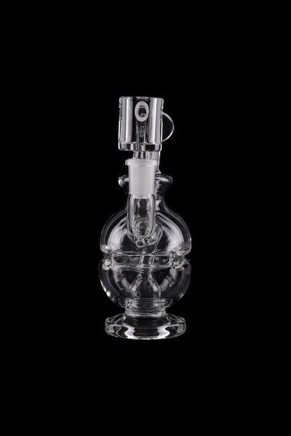 Clear glass water pipe (rig) with intricate bubbler design, isolated on black.