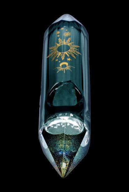 Emerald green glass water pipe with gold celestial designs, featuring a bulbous chamber and pointed mouthpiece, against a black background.