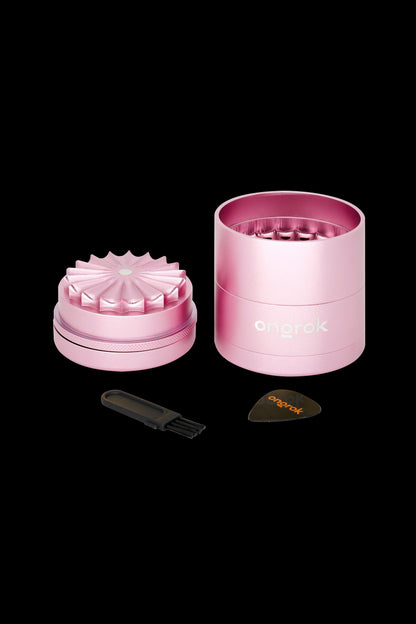 Pink Grinder with cleaning tool and card.