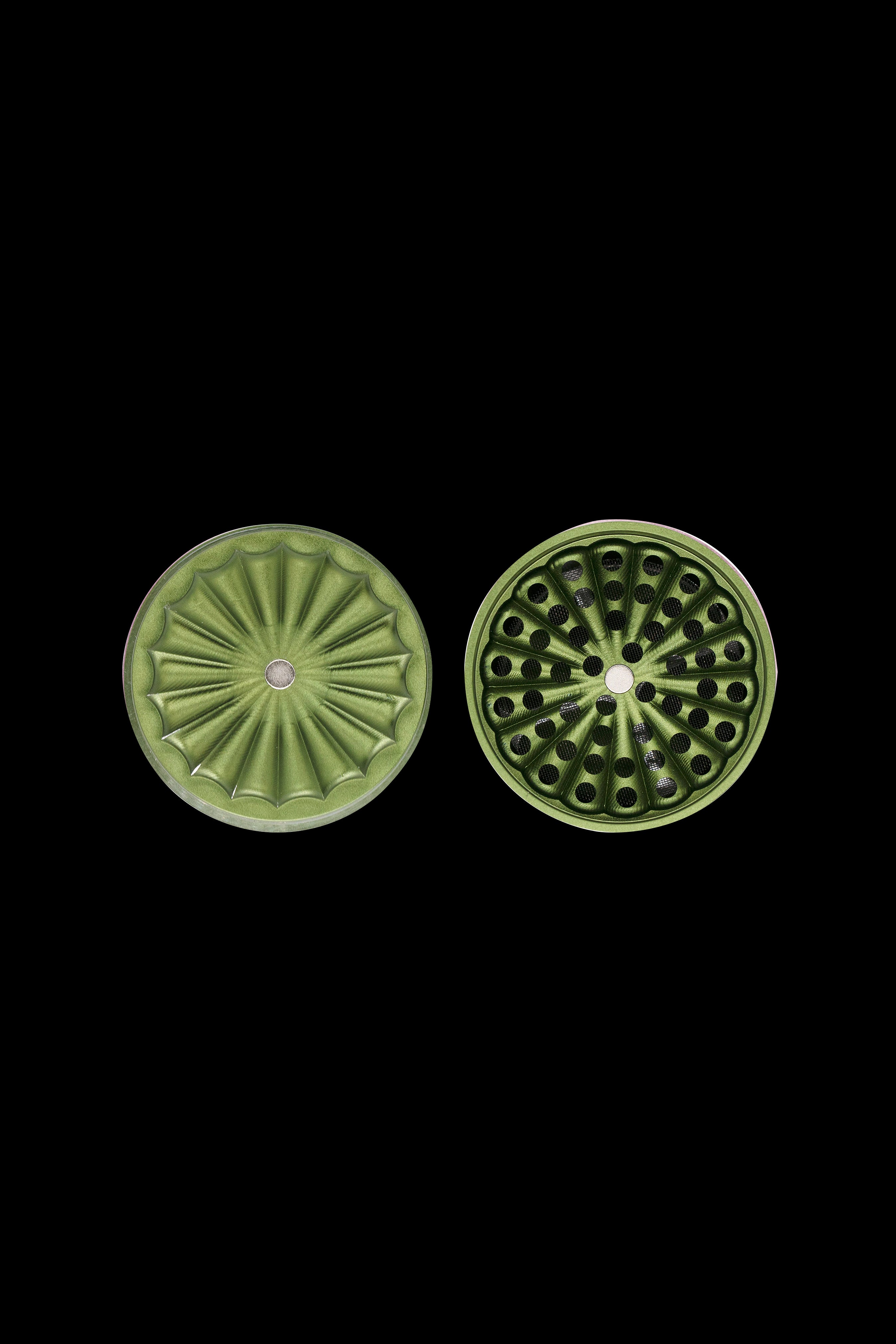 Two green, patterned cannabis smoking filters displayed against a black background.