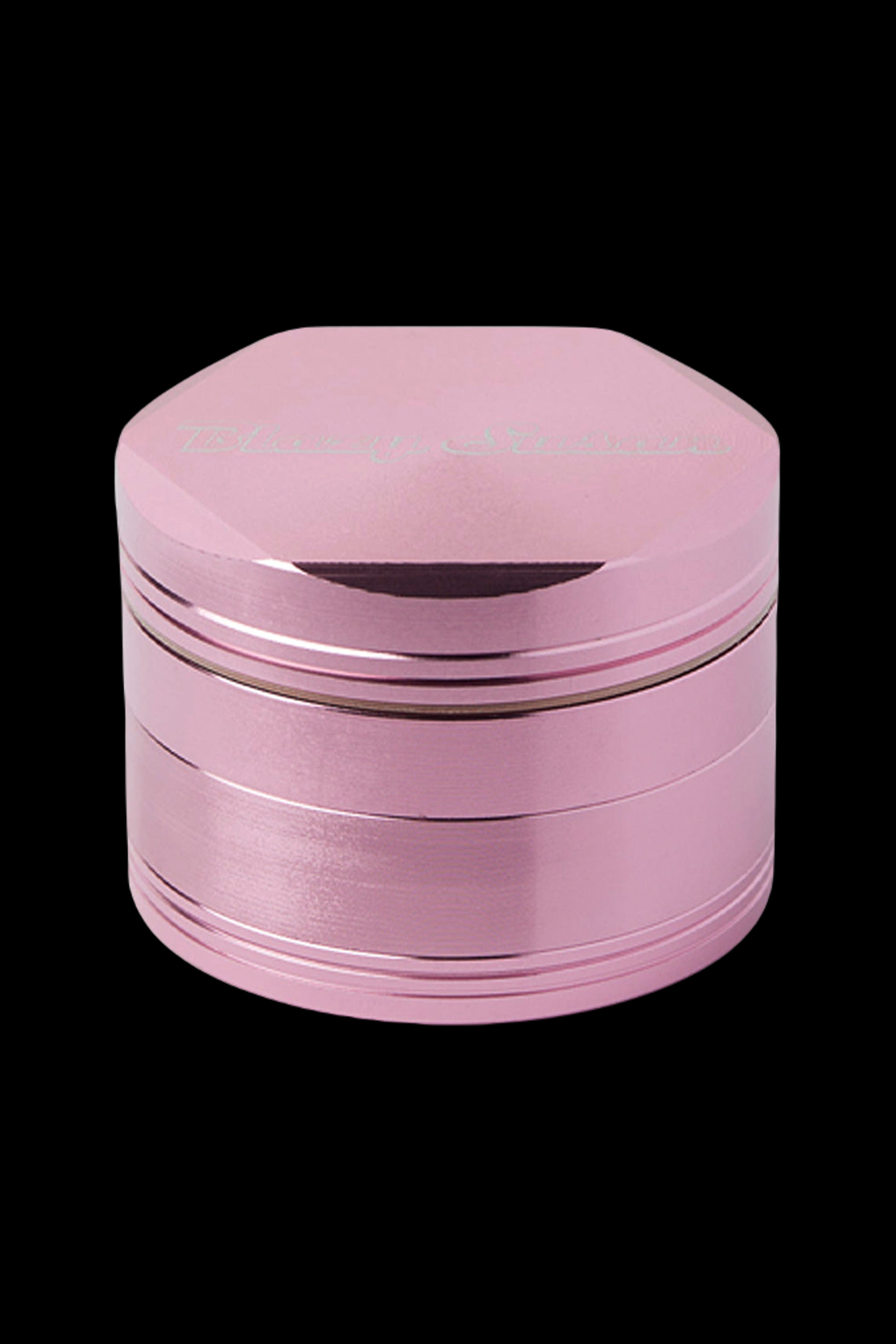 Pink metal grinder for cannabis.