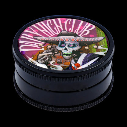 Top-down close-up of the Black Skull Mini Travel Grinder showing a colorful skull-in-sombrero graphic under glossy dome.